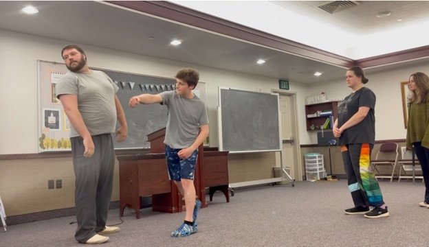 Students rehearsing a scene during class