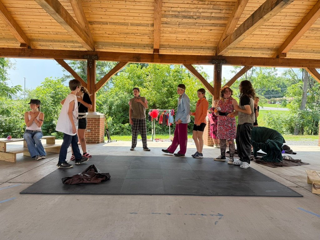 Campers gathered in a pavilion at Puck’s Midsummer Mischief camp